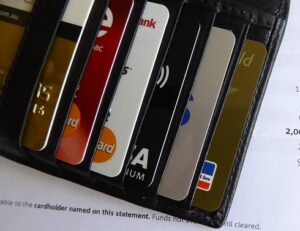 A picture of a wallet with different credit cards in it.