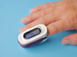 Oximeter on a finger.