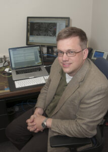 Full size picture of Mark Hoffman, PhD at his desk.