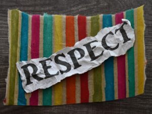 The word respect on multicolored material.